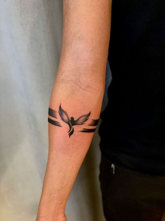 phoenix forearm band tattoo design for women