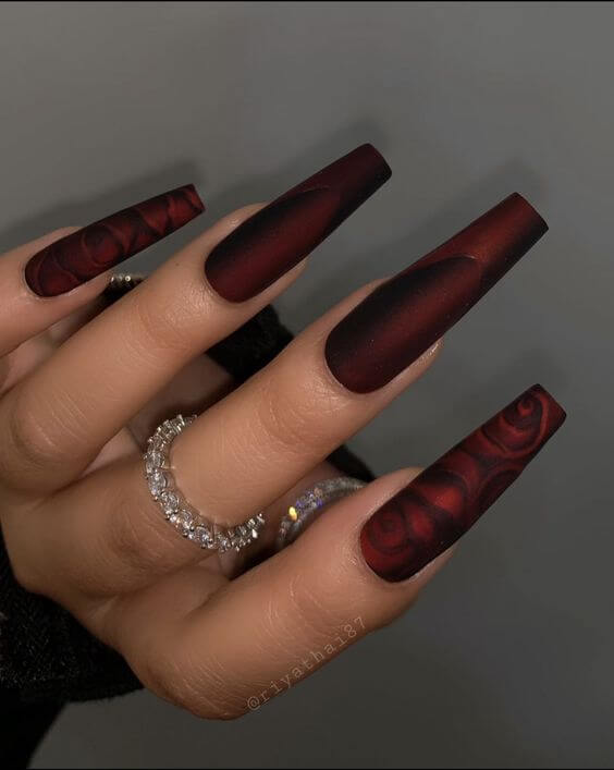 swirls with deep maroon and black coffin nails