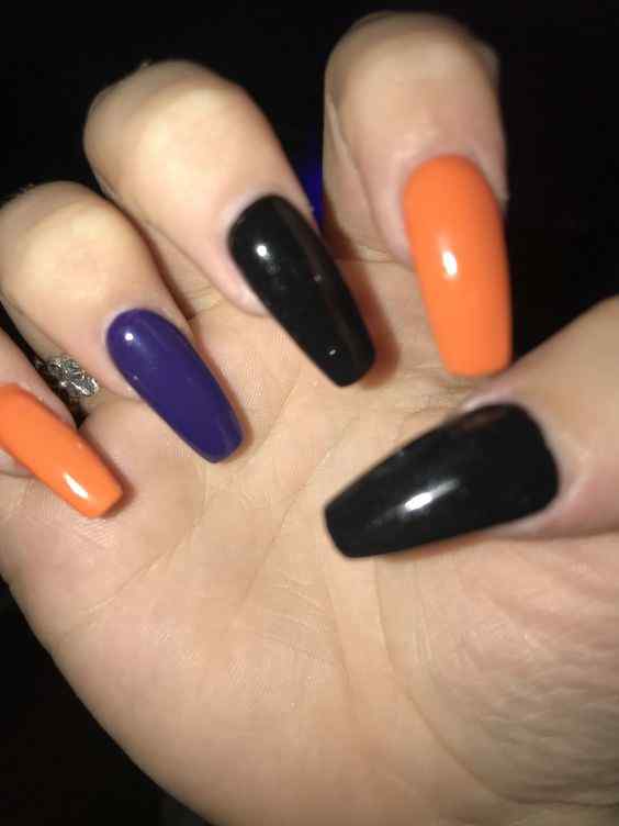 coffin black with orange and purple nails