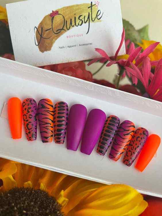 lion-cheetah with tiger prints press on orange and purple nails
