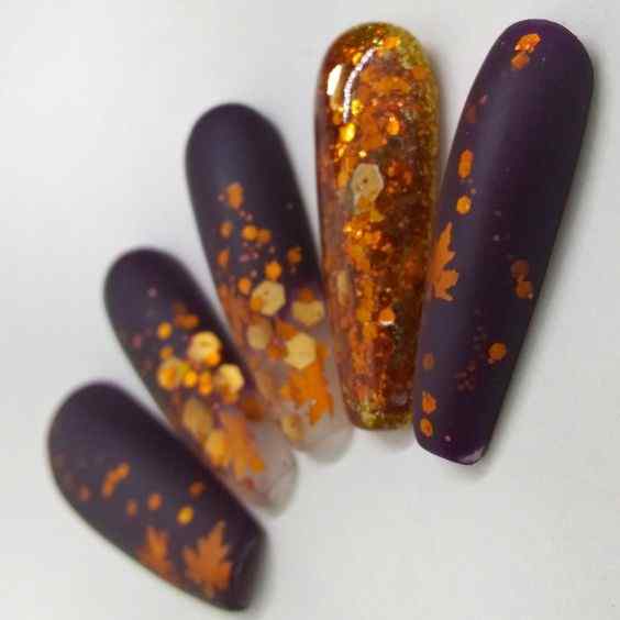 fall leaves and glitter orange and purple nails
