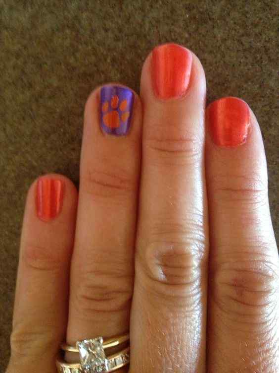 paw print orange and purple nails