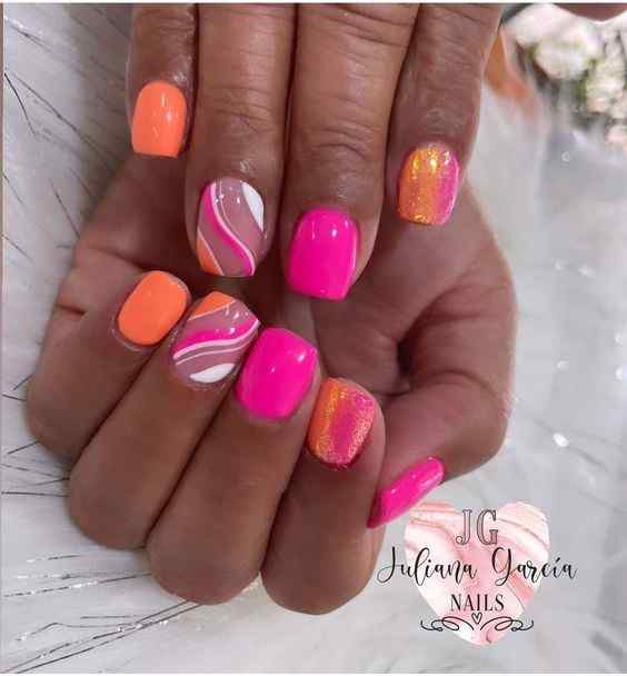 short glitter with swirls summer orange and pink nails