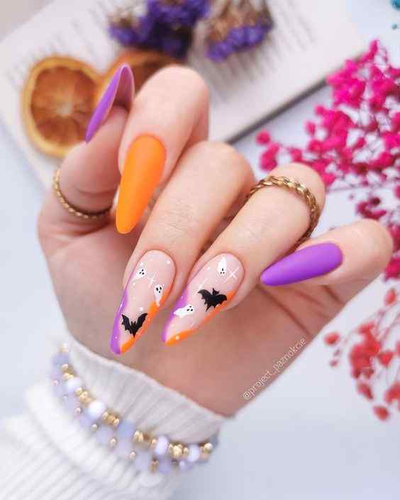 spooky Halloween designs orange and purple nails