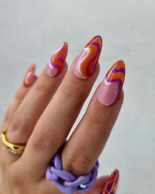 nude and wavy silver glitter with orange and purple nails