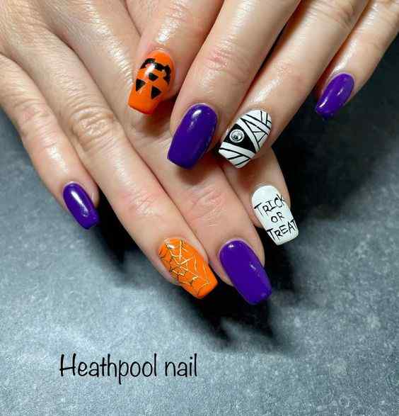 Halloween white with purple and orange nails 