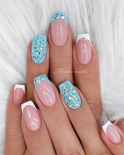 white French tips with glittery light blue nails designs