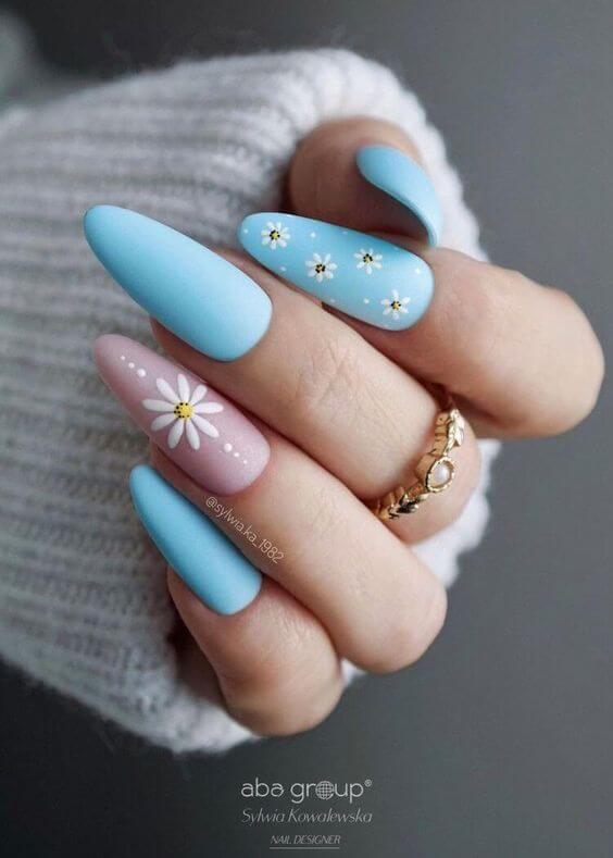 tiny daisy flowers with matte pink and light blue nail designs