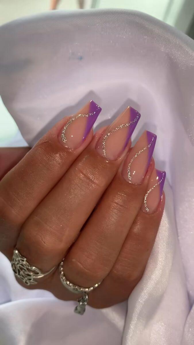 square acrylic nude with purple and silver glitter swirly line nails designs