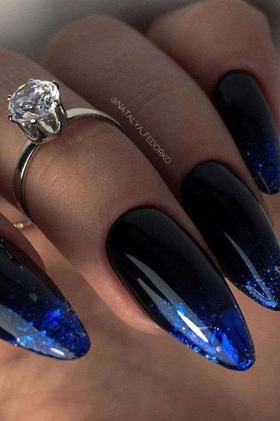 black with blue glitter nail art design