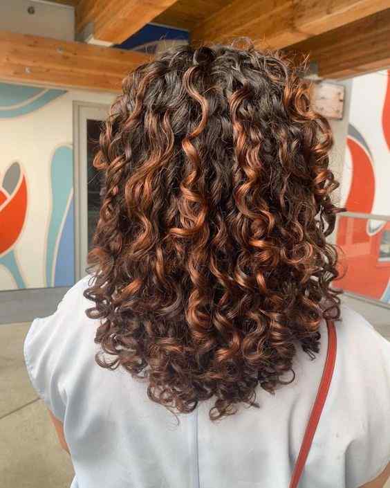 natural curly hair with red highlights