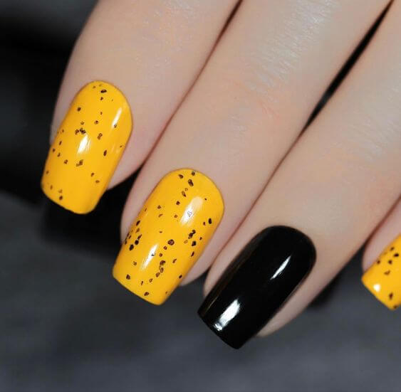 yellow and black with dots nail art designs