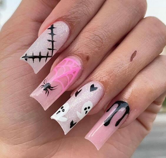 glitter nude with black and pink halloween nail art designs