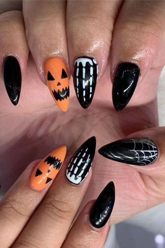 black and orange with scary pumpkin face halloween nails art designs