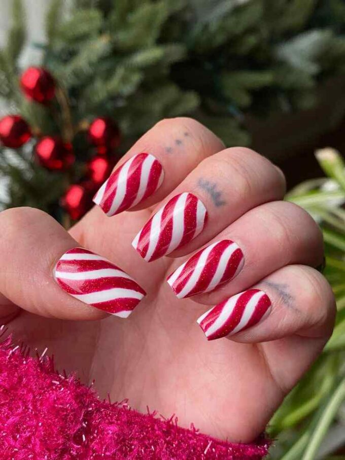 swirly candy cane red and white christmas nails