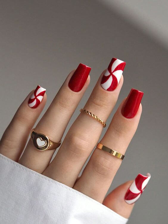 swirly red and white candy cane christmas nails