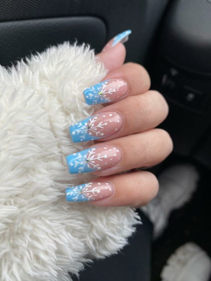 blue french tips with white snowflakes christmas nail designs
