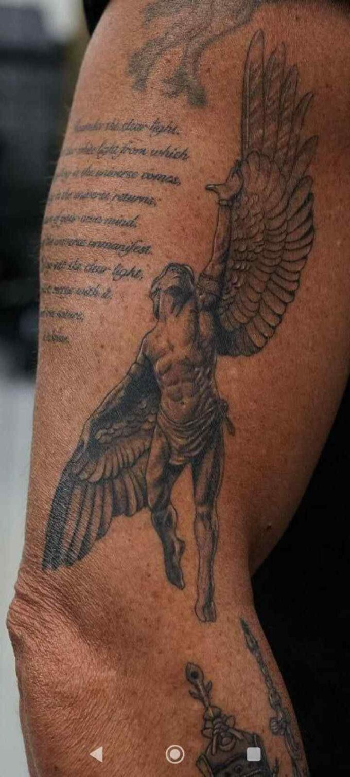 angel with wings tattoo on upper arm for men