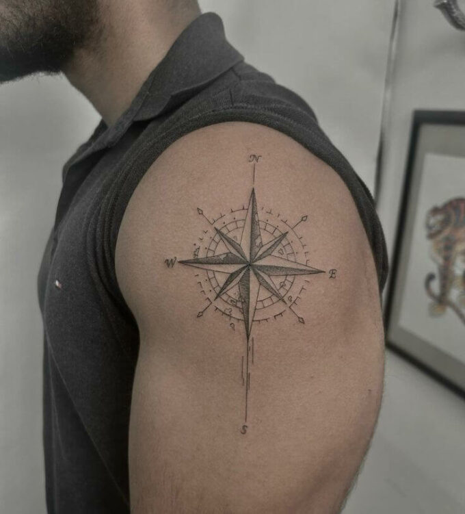 compass tattoo on upper arm for men