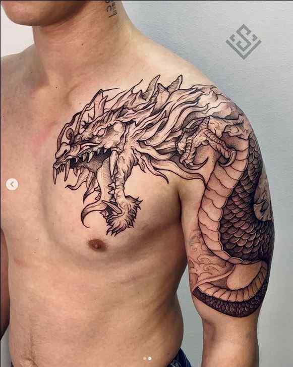 dragon tattoo on upper arm for men