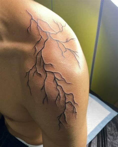 lightning tattoo on upper arm for men