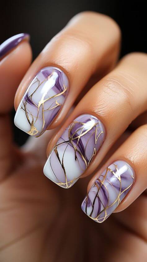 marble lavender with gold line nail designs