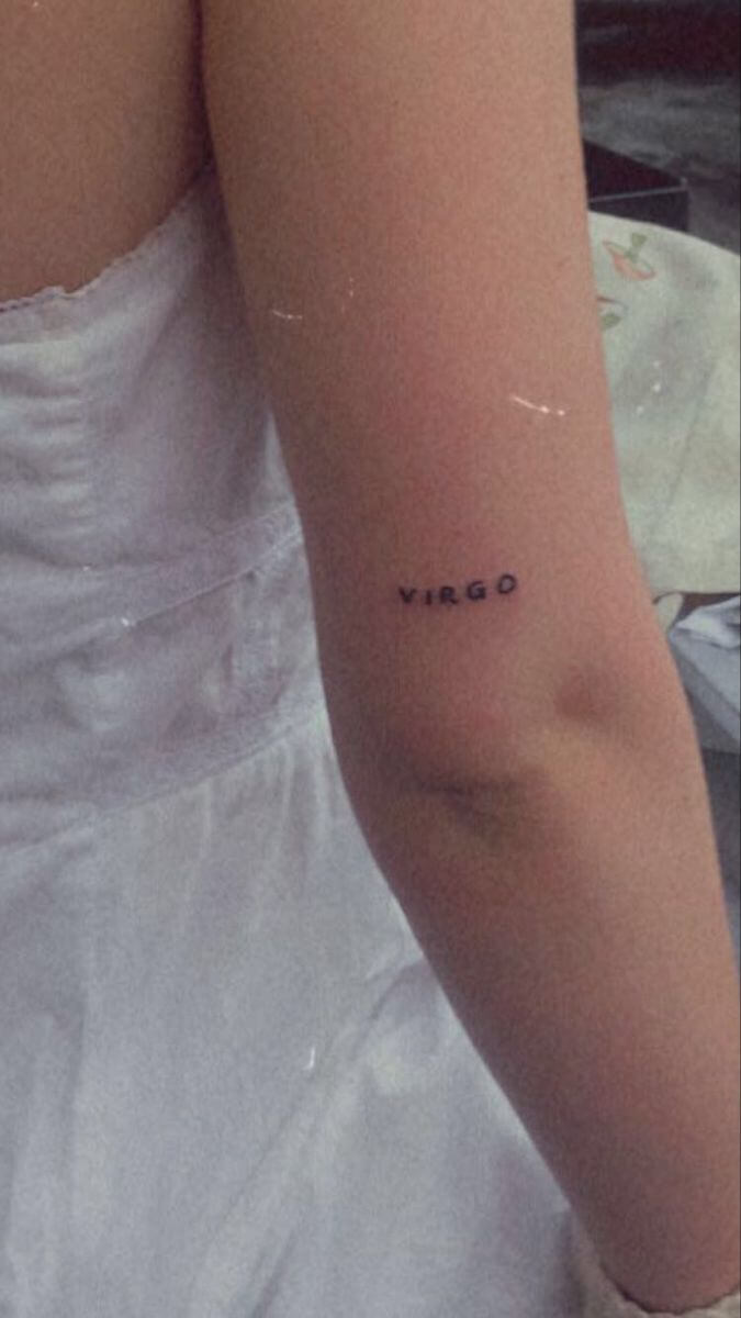 virgo tattoo on back arm for females