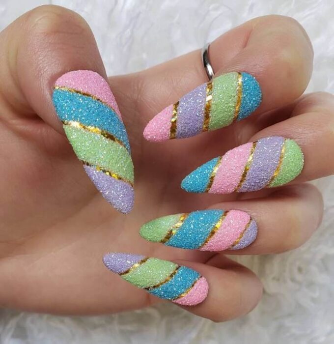 gold stripes with pastel multicolor glitter nail designs