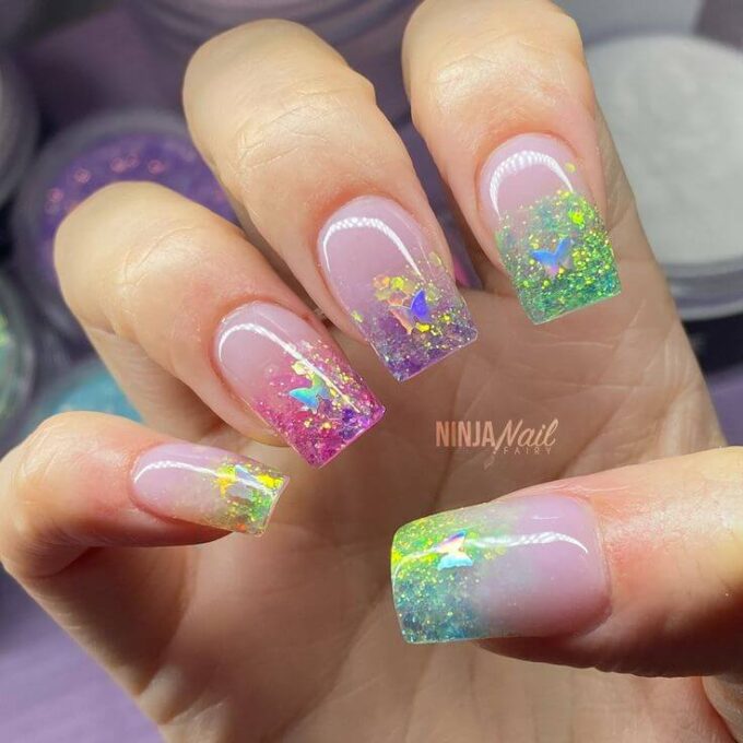 multicolor glitter nails with butterfly designs
