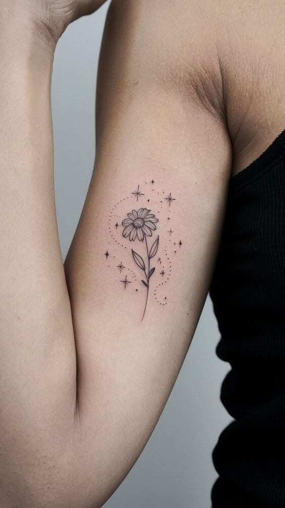 stars and sunflower tattoo design on bicep