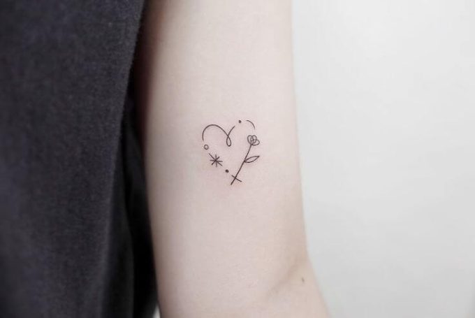 heart with star and flower tattoo design