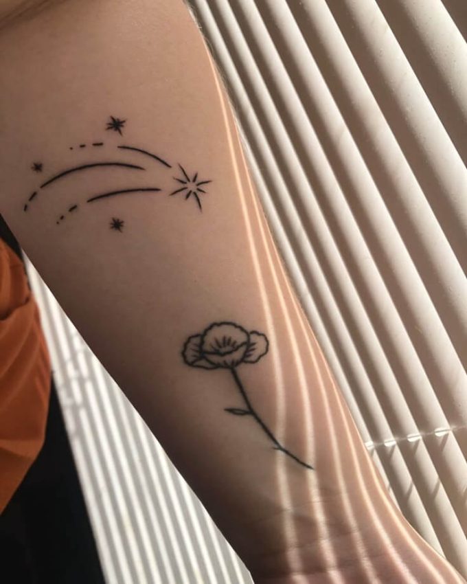 shooting stars and flower forearm tattoo design