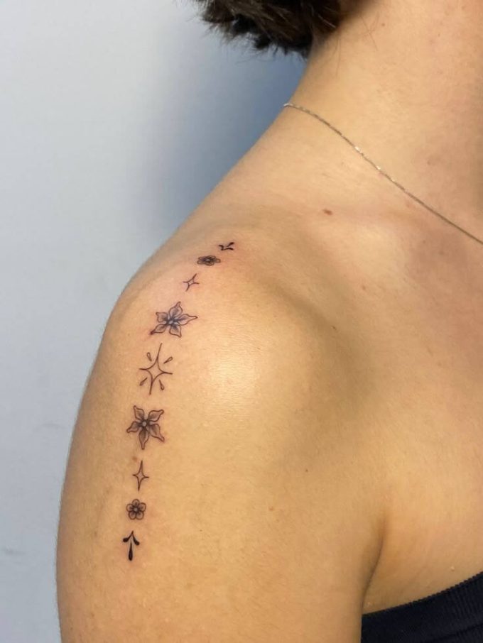 stars and flowers tattoo design on shoulder