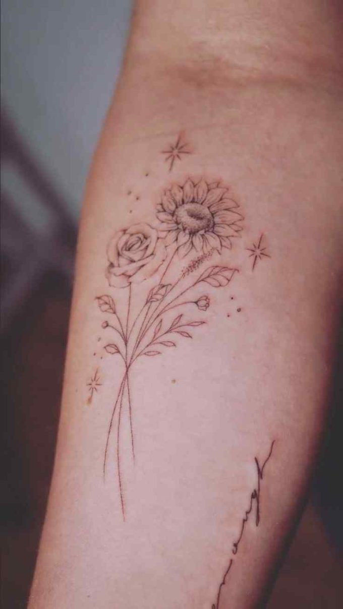 sunflower and rose with stars tattoo design on forearm
