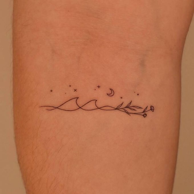 wave with flower and stars with moon tattoo design