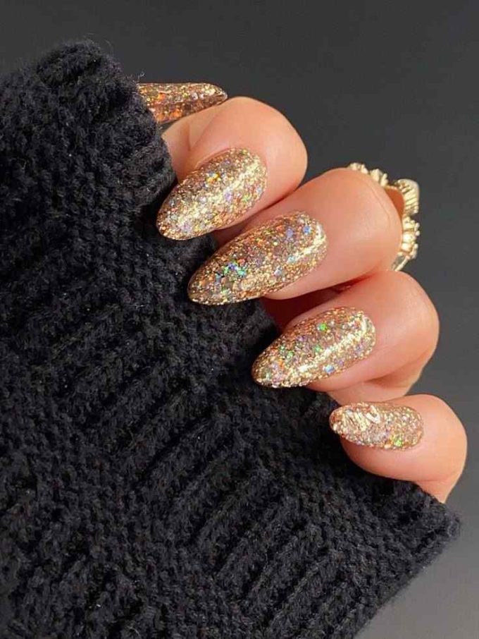 almond shaped gold glitter christmas nails